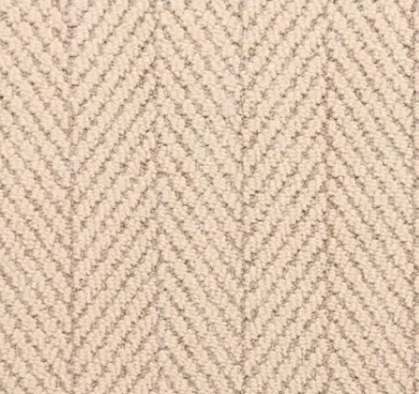 Soft beige herringbone carpet featuring textured wool style flooring.
