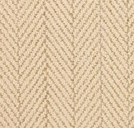 Soft beige herringbone carpet with textured pattern, ideal for luxurious residential or commercial flooring.