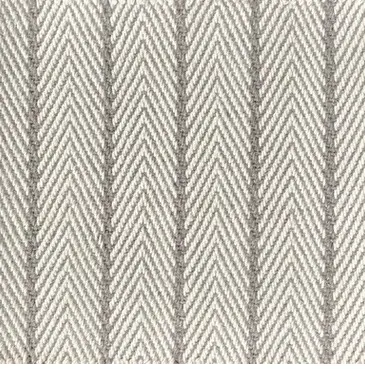 Natural fiber patterned area rug with neutral tones.