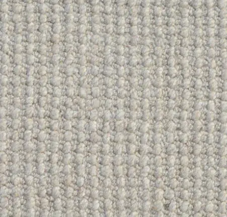 Soft beige carpet with textured loop pile flooring, ideal for residential and commercial spaces.