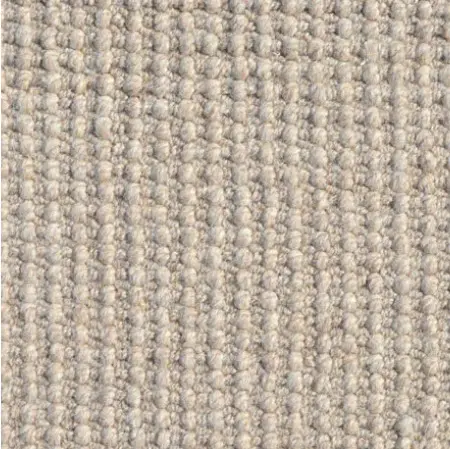 Luxurious beige carpet with textured loop pile, perfect for home or office flooring.