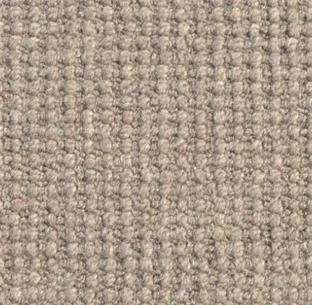 Textured beige carpet sample demonstrating durable commercial flooring options from Creative Floors.