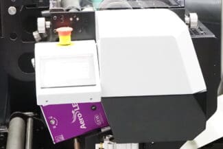 Automatic label printing machine for product branding and packaging.