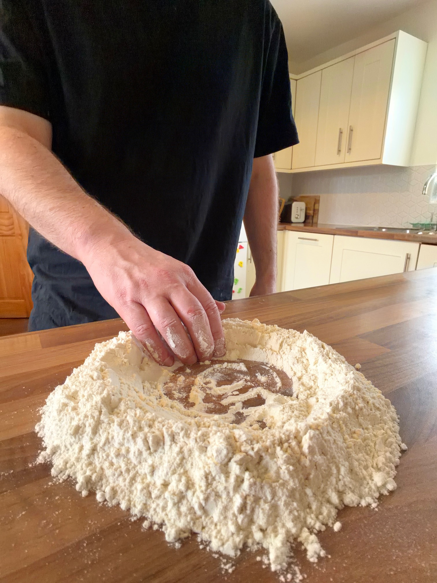 make a well of flour on work surface