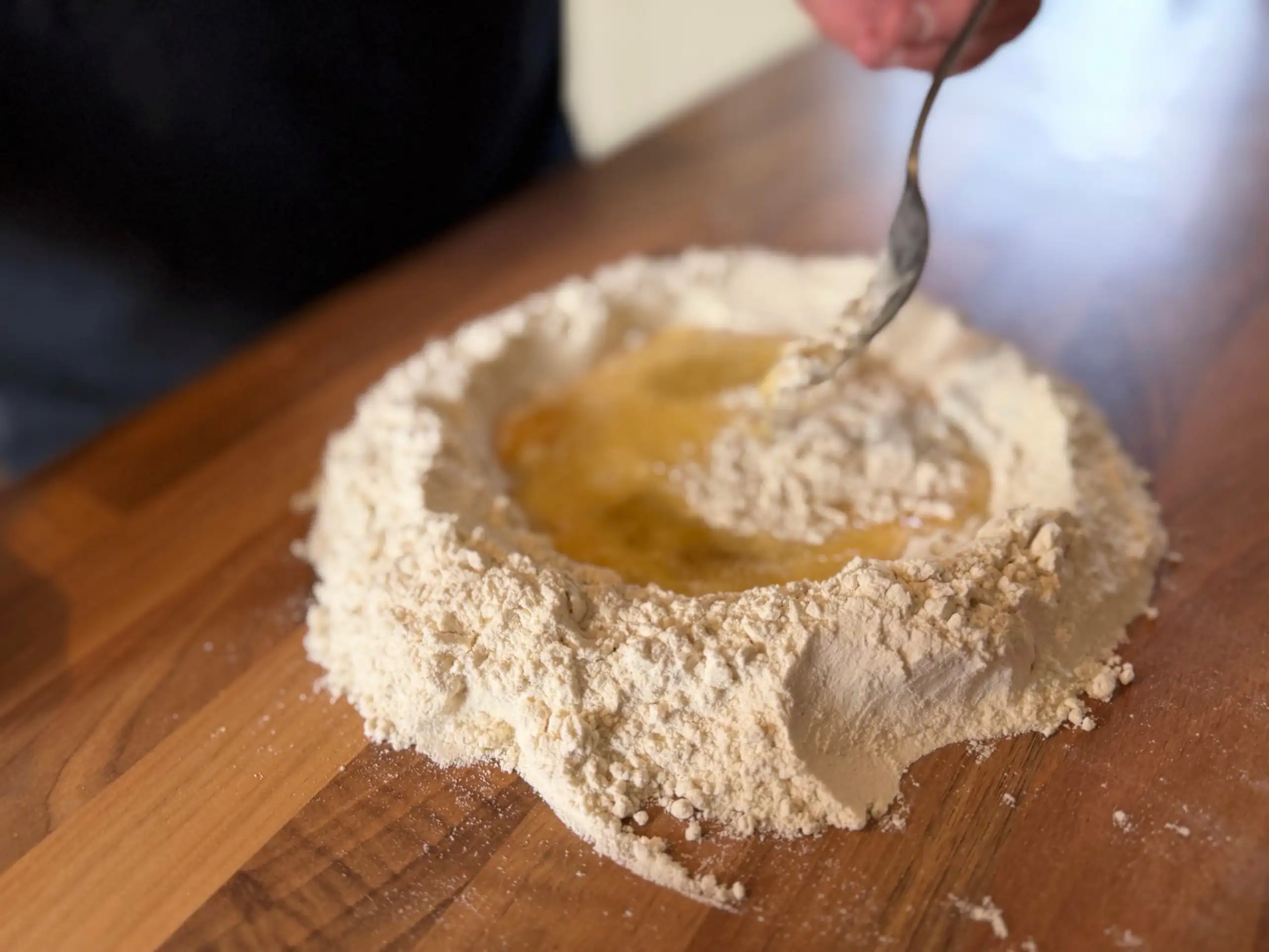puling flour into the eggs