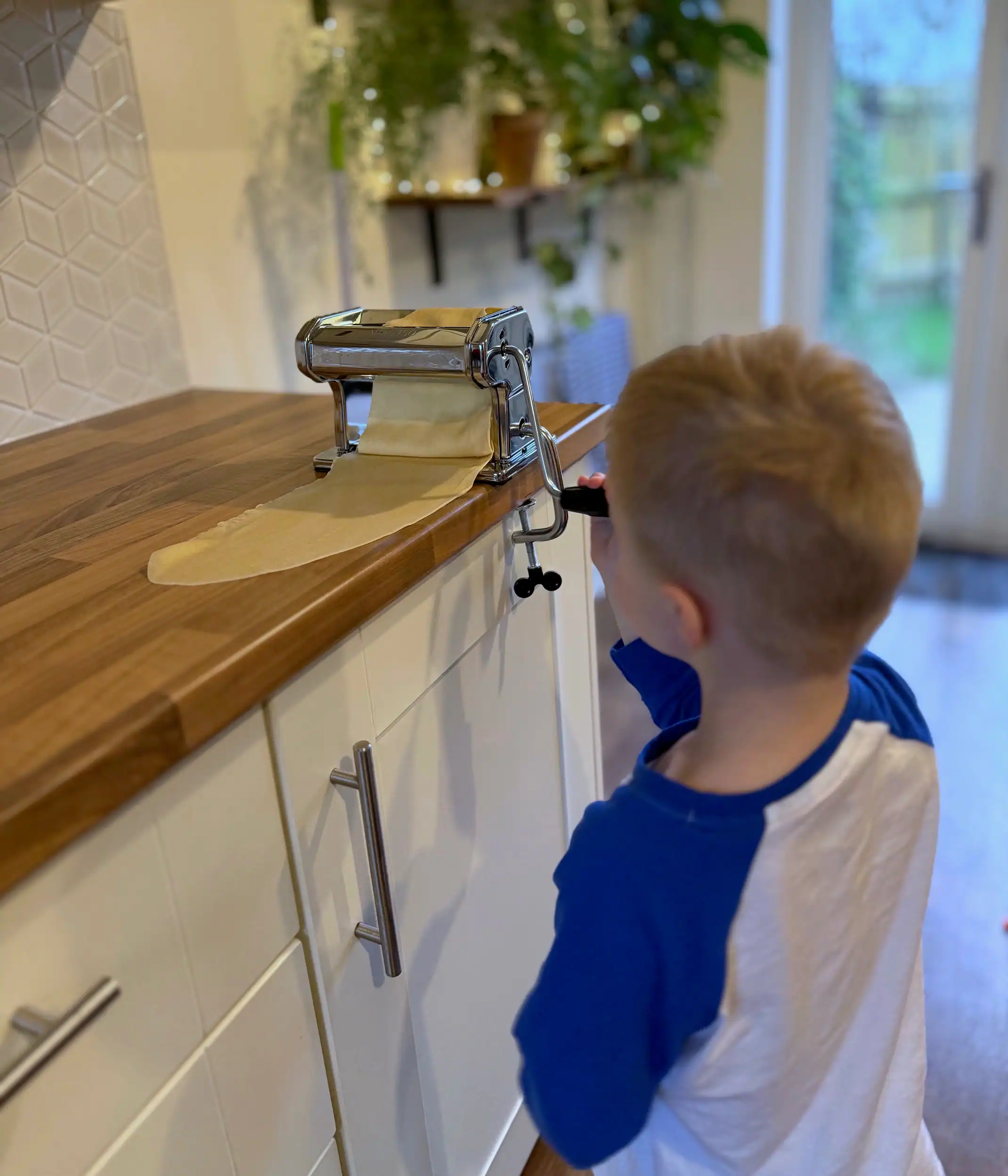 child using pasta machine