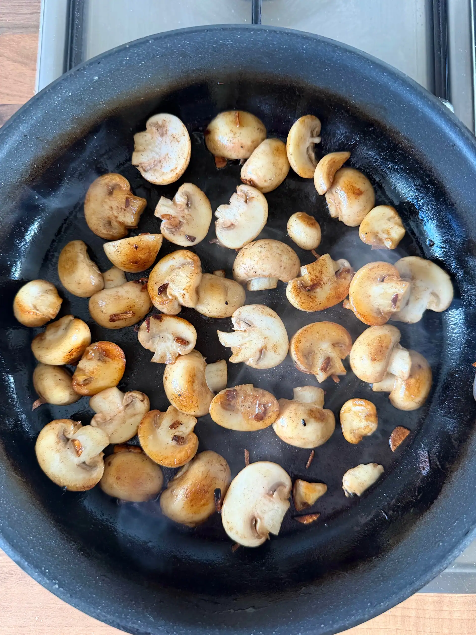 cooking mushrooms in a pan
