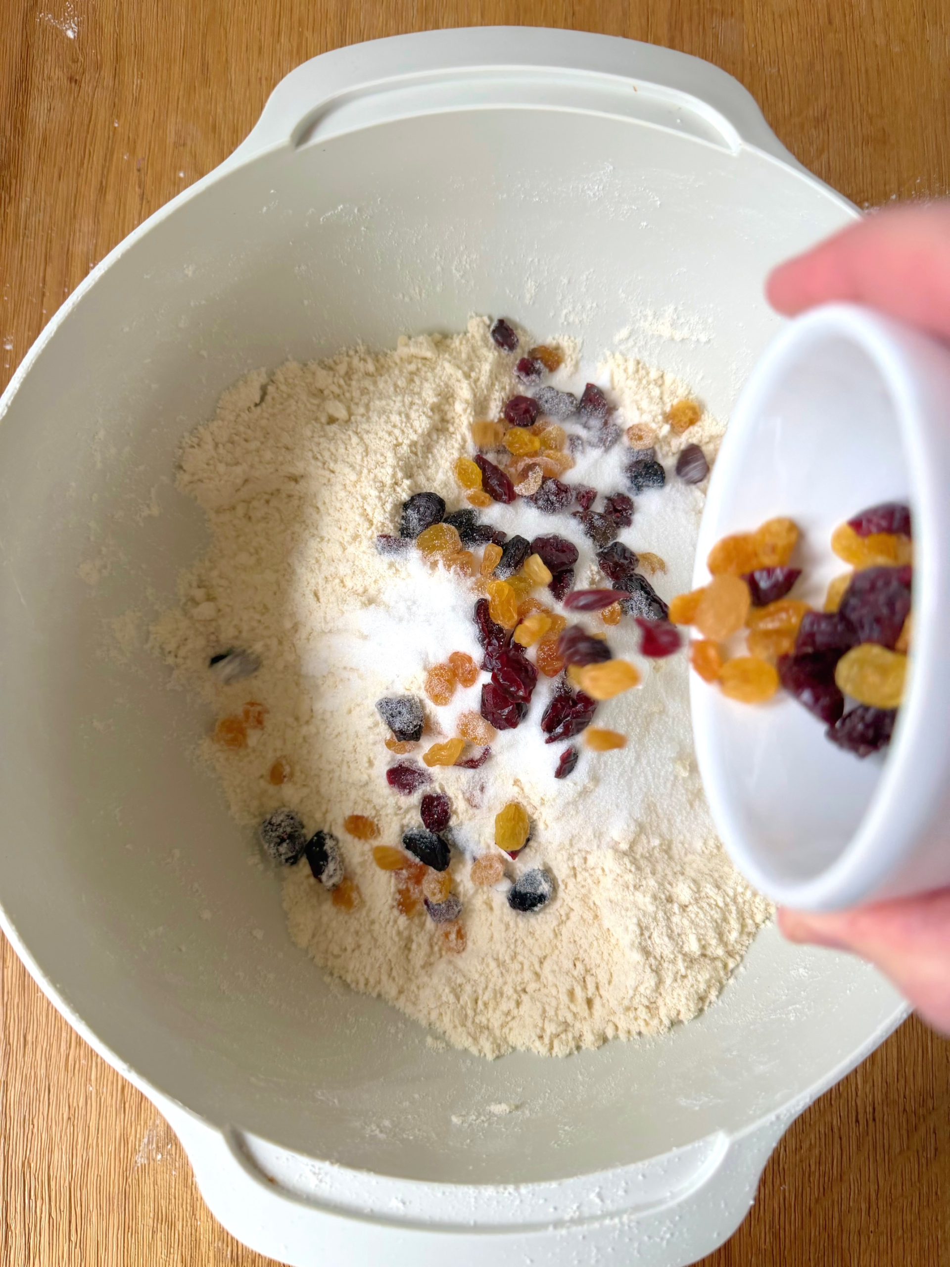 adding dried fruit to bowl