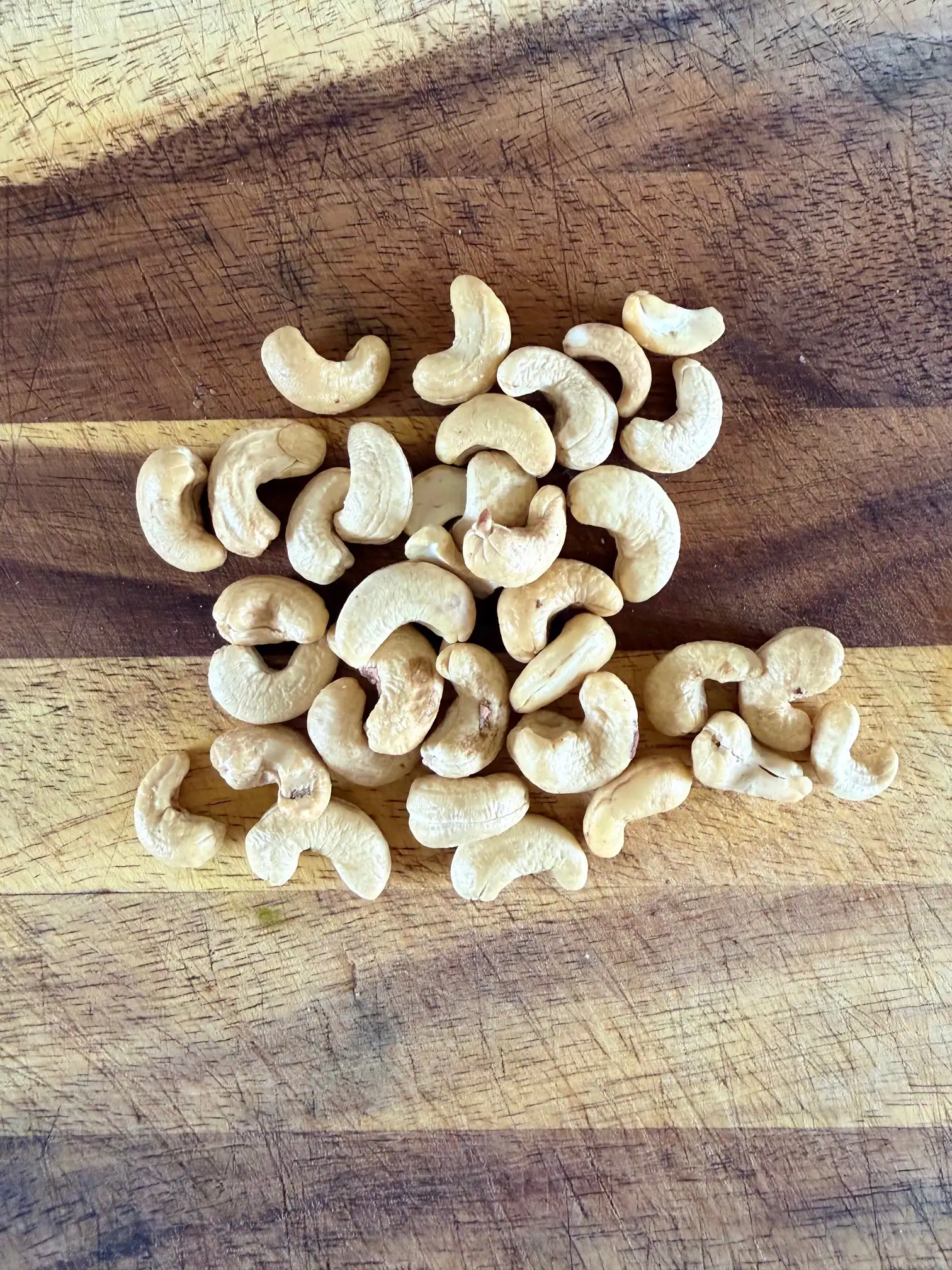 cashew nuts on a chopping board