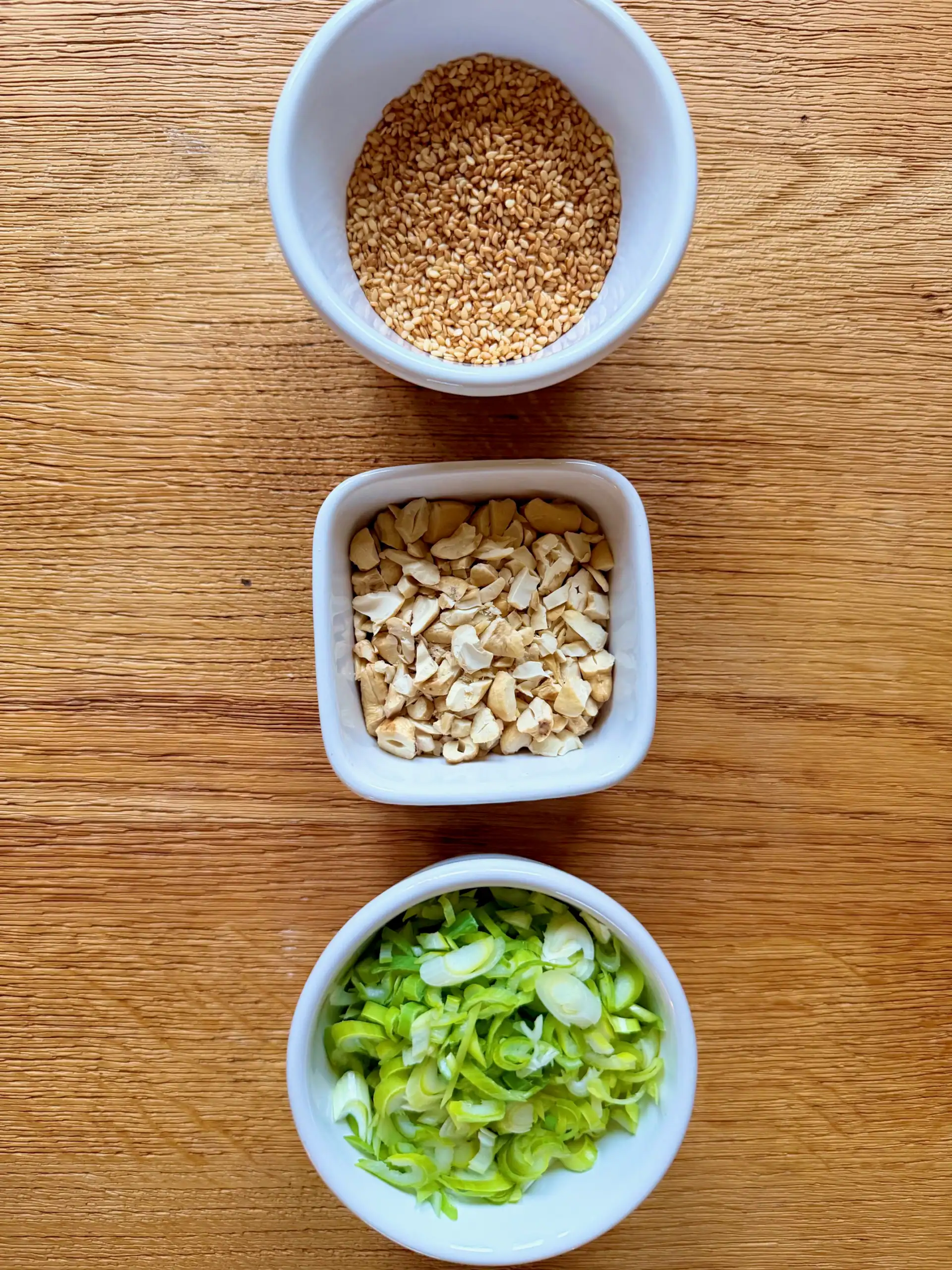 garnishes on a table in individual dishes