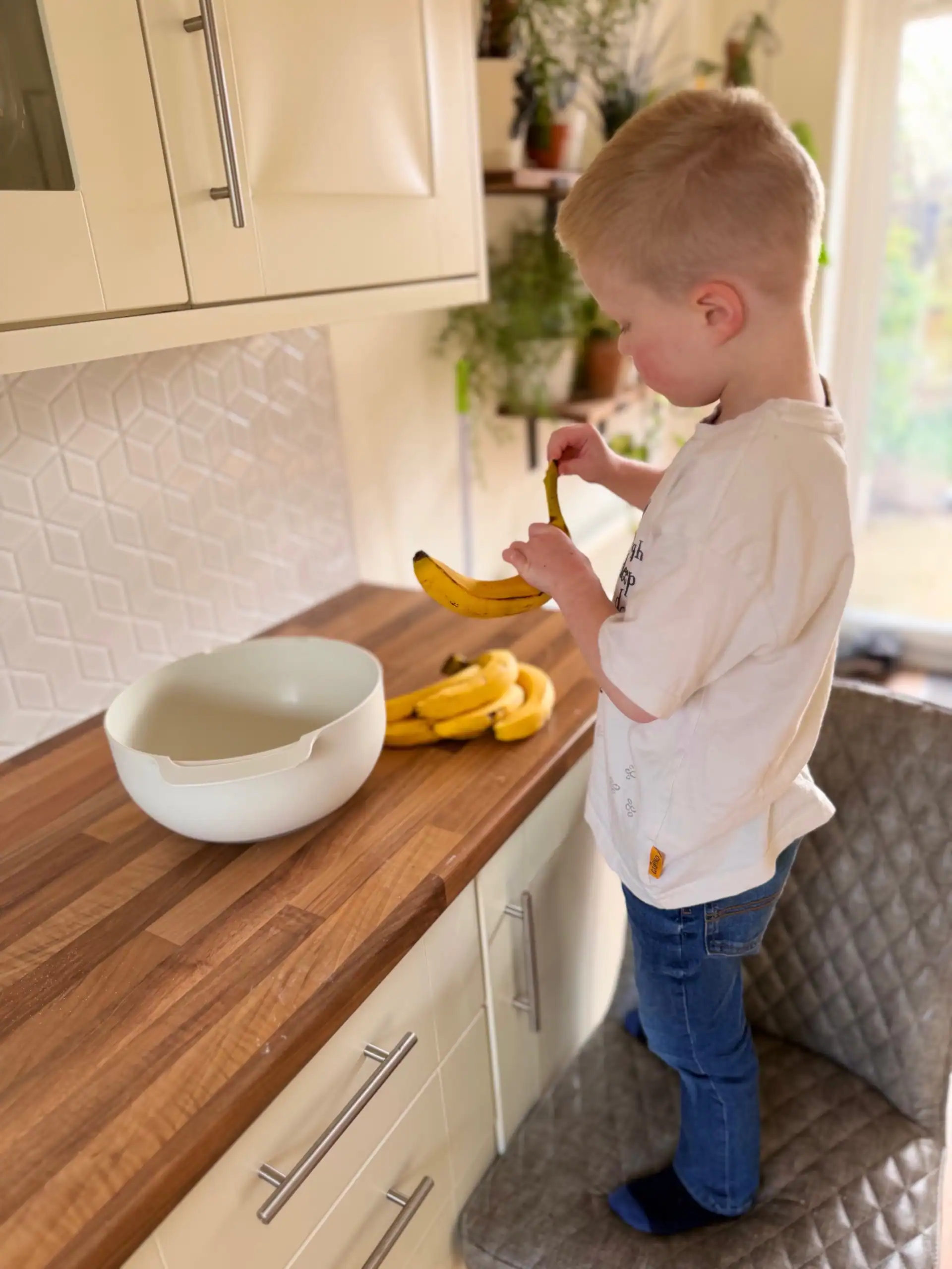 boy peeling bananas