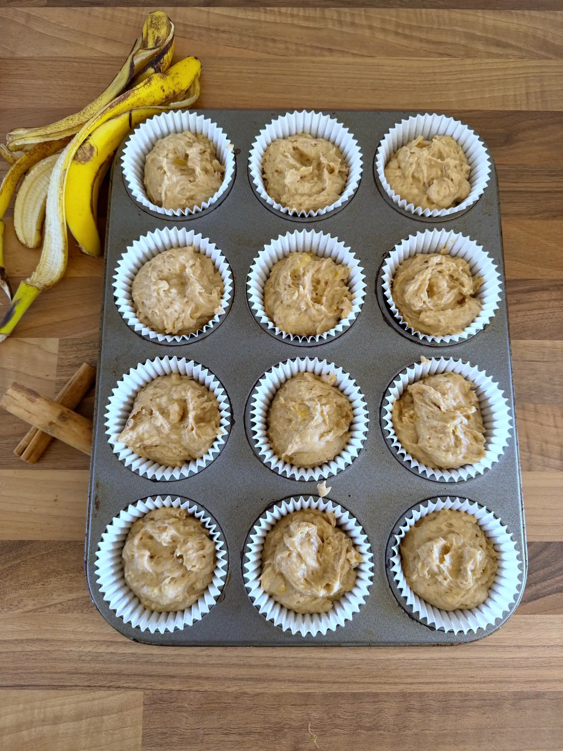 banana bread batter in muffin cases