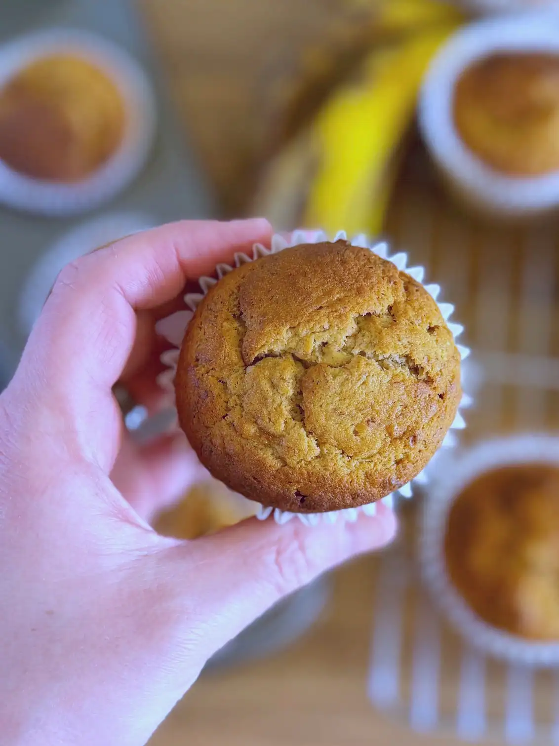 holding a banana bread muffin