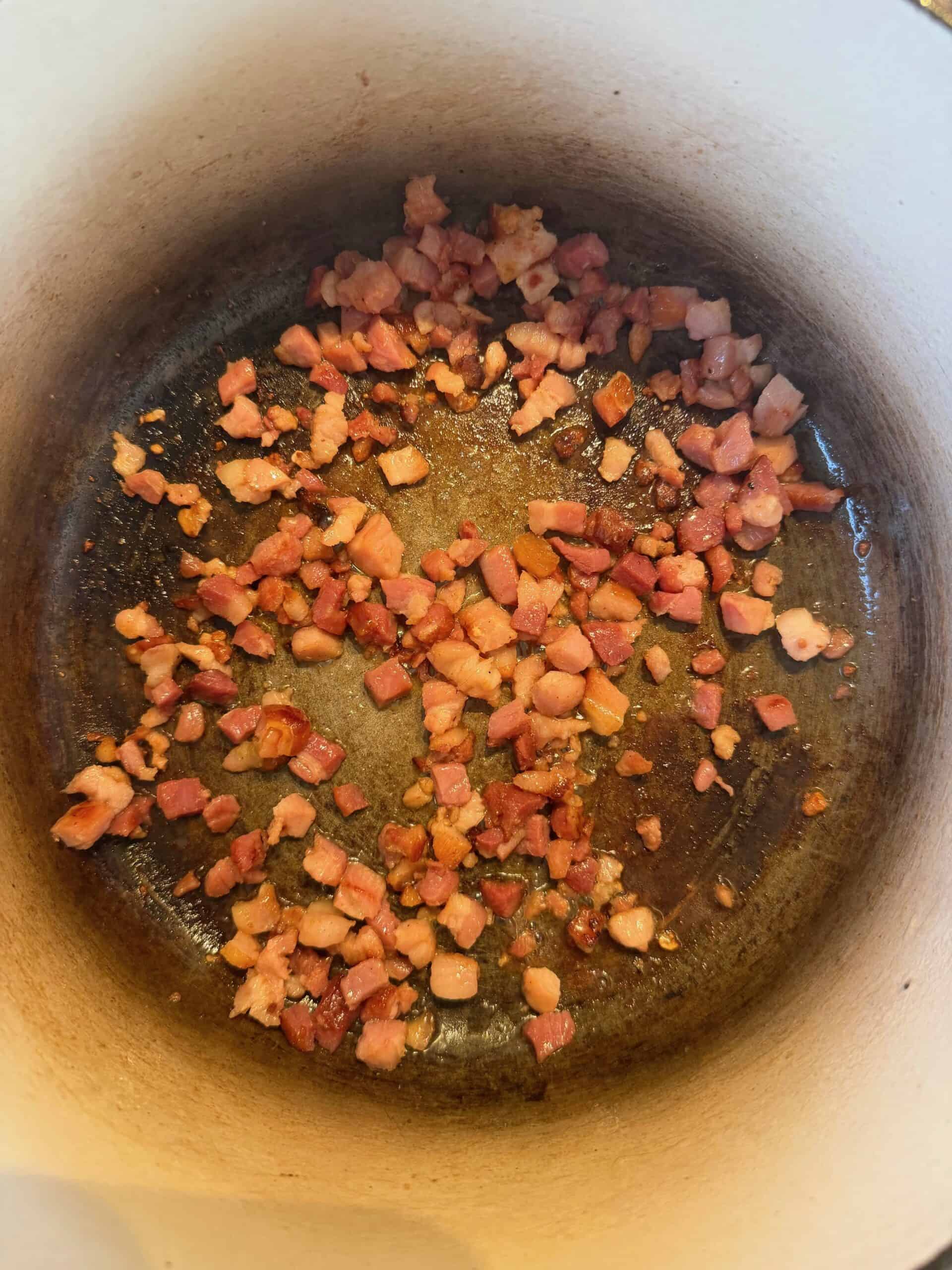 cooking bacon in a pan