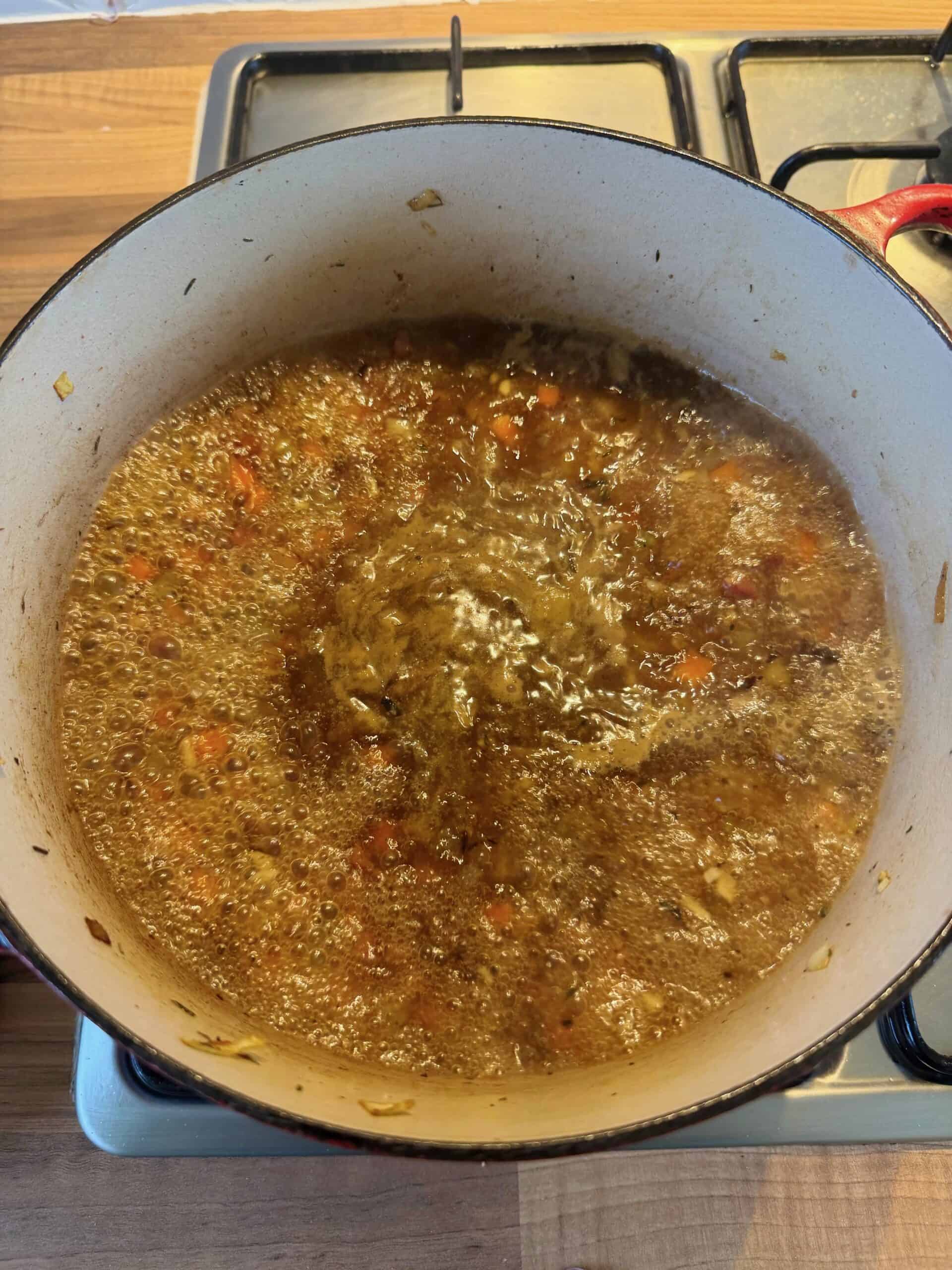 add chicken stock to pan