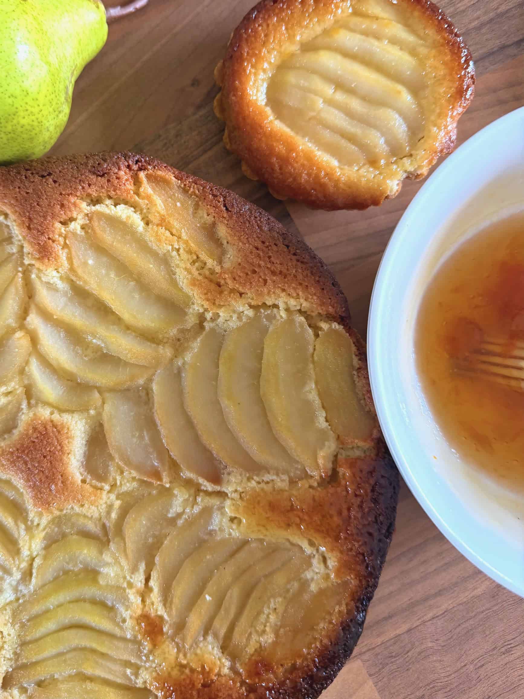 baked pear and frangipane tart with glaze in bowl