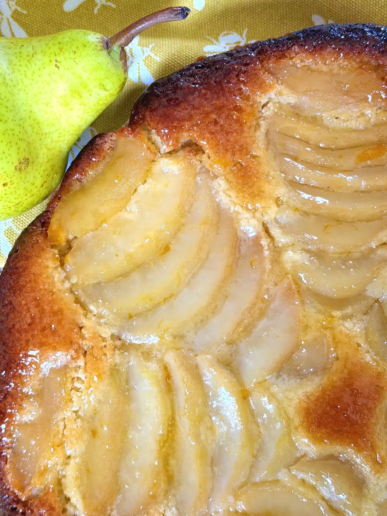 close up photo of elegant poached pear and frangipane tart