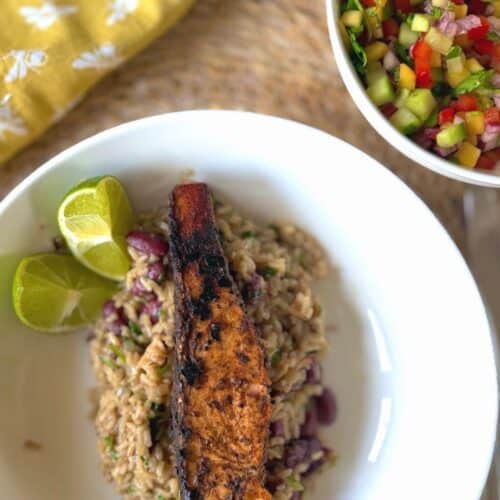 jerk salmon ontop of rice and peas with lime and colourful mango salsa