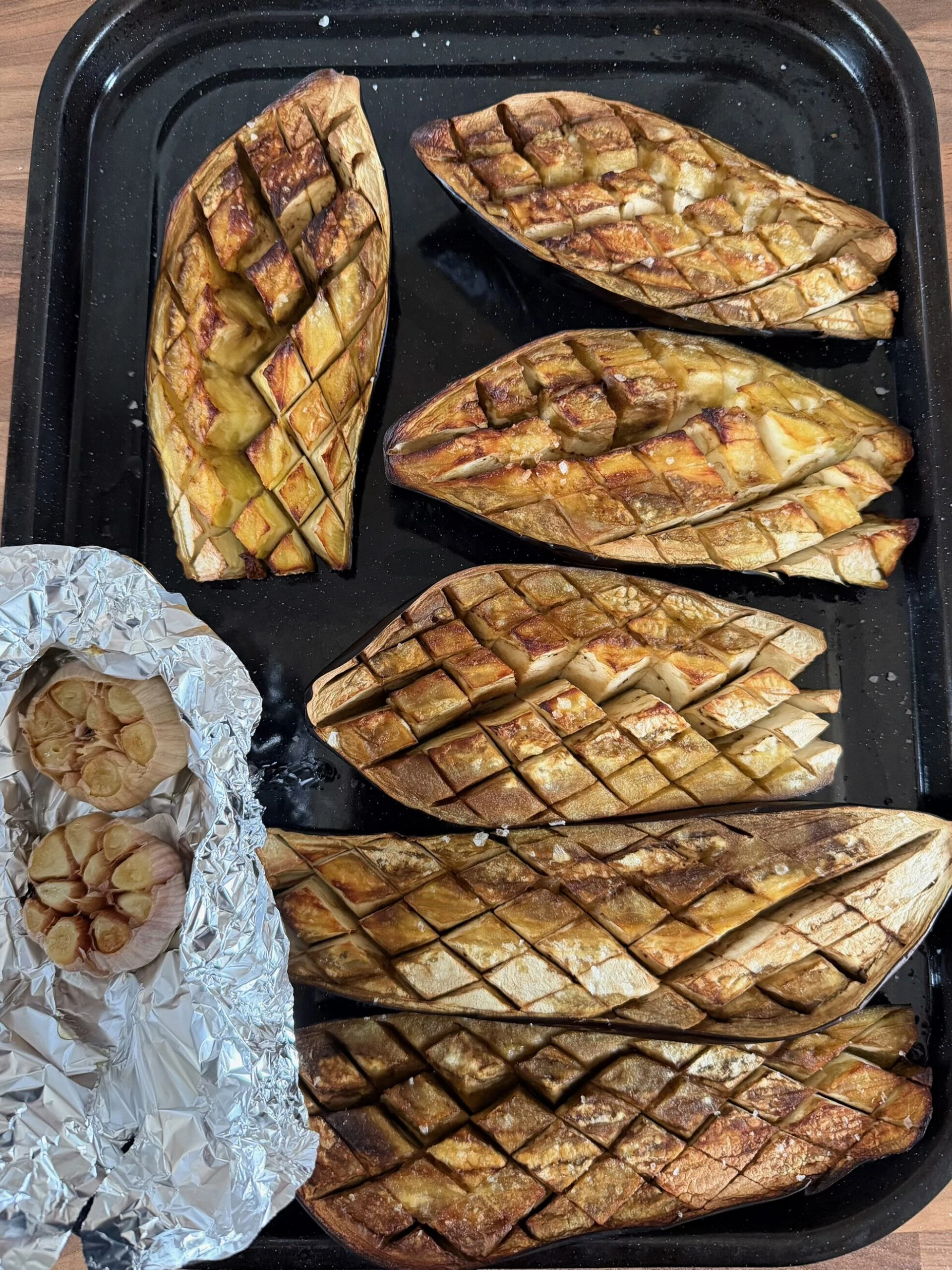 leaving aubergines and garlic to cool