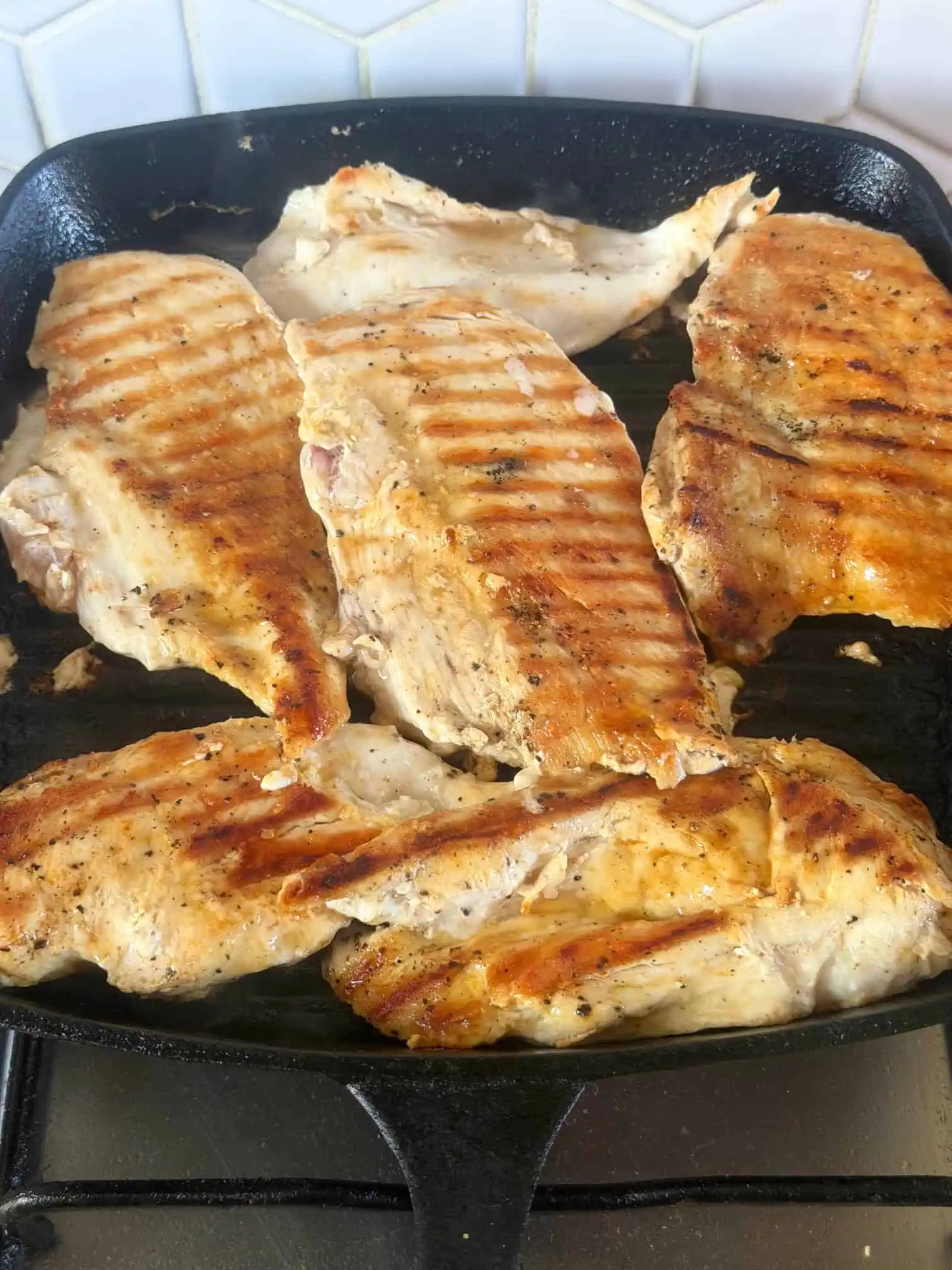 Cooking chicken on a griddle pan