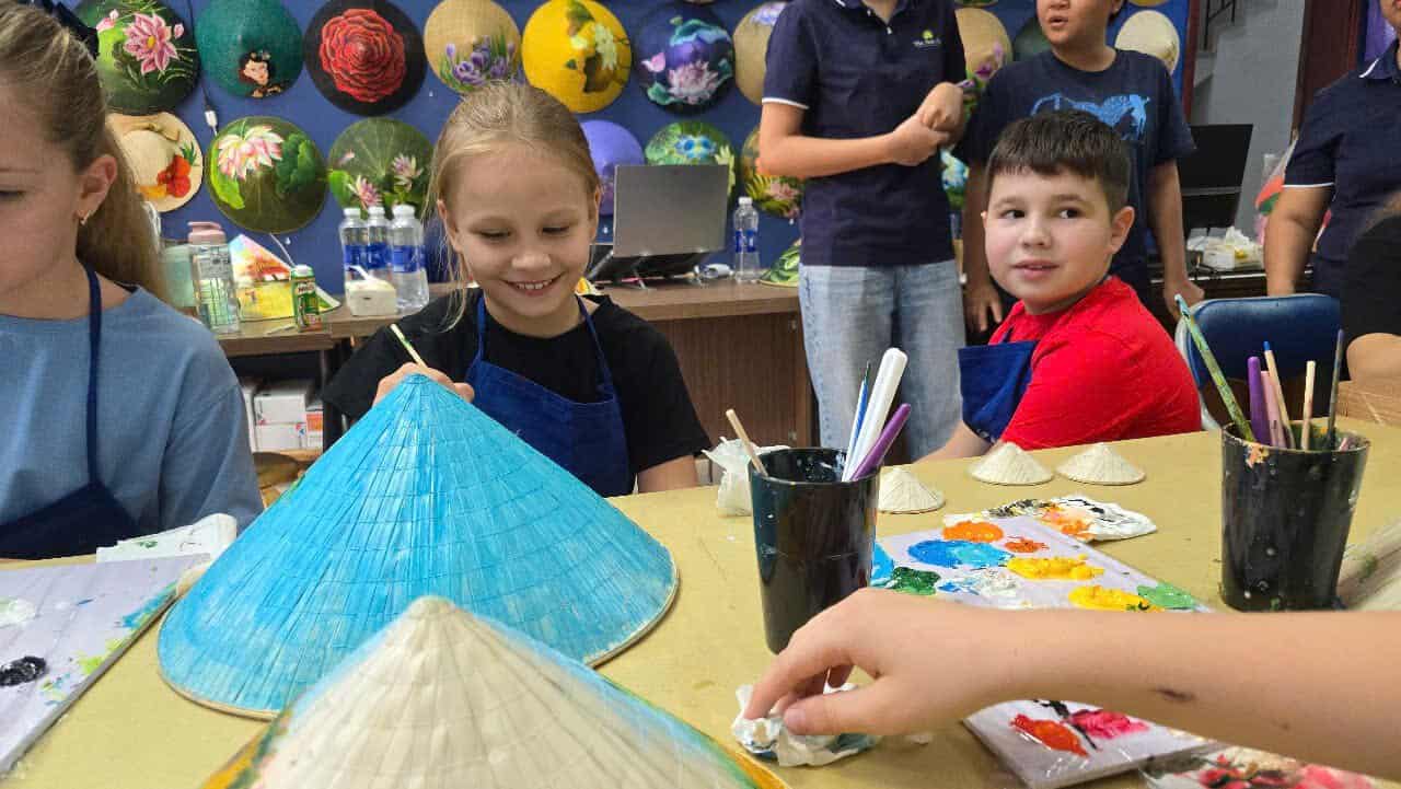 craft workshops for students in Vietnam, including conical hat painting, Vietnamese cultural activities