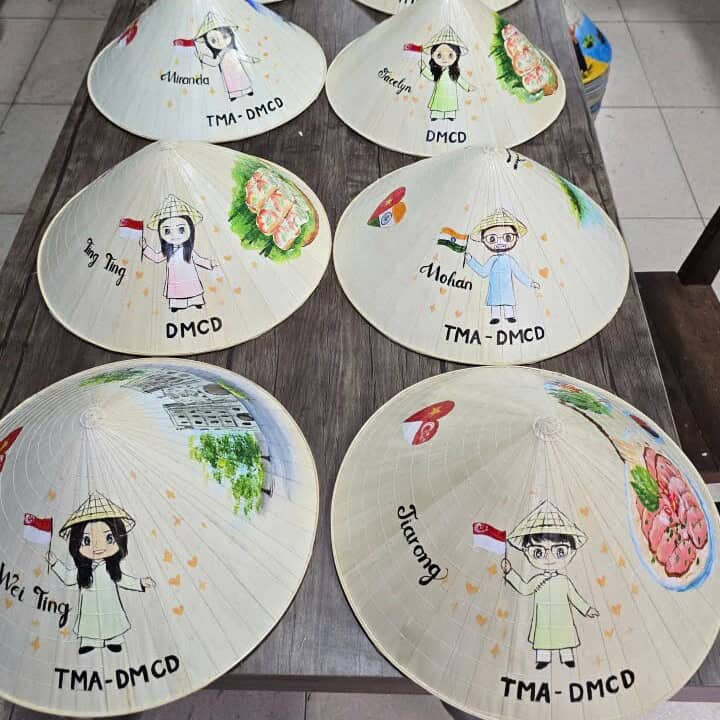 Couple chibi artwork on a handmade Vietnamese conical hat