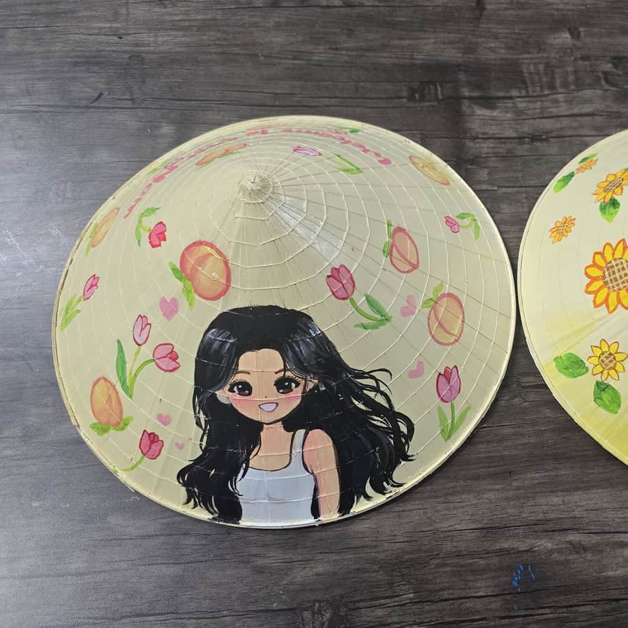 Custom chibi portrait painted on a Vietnamese conical hat
