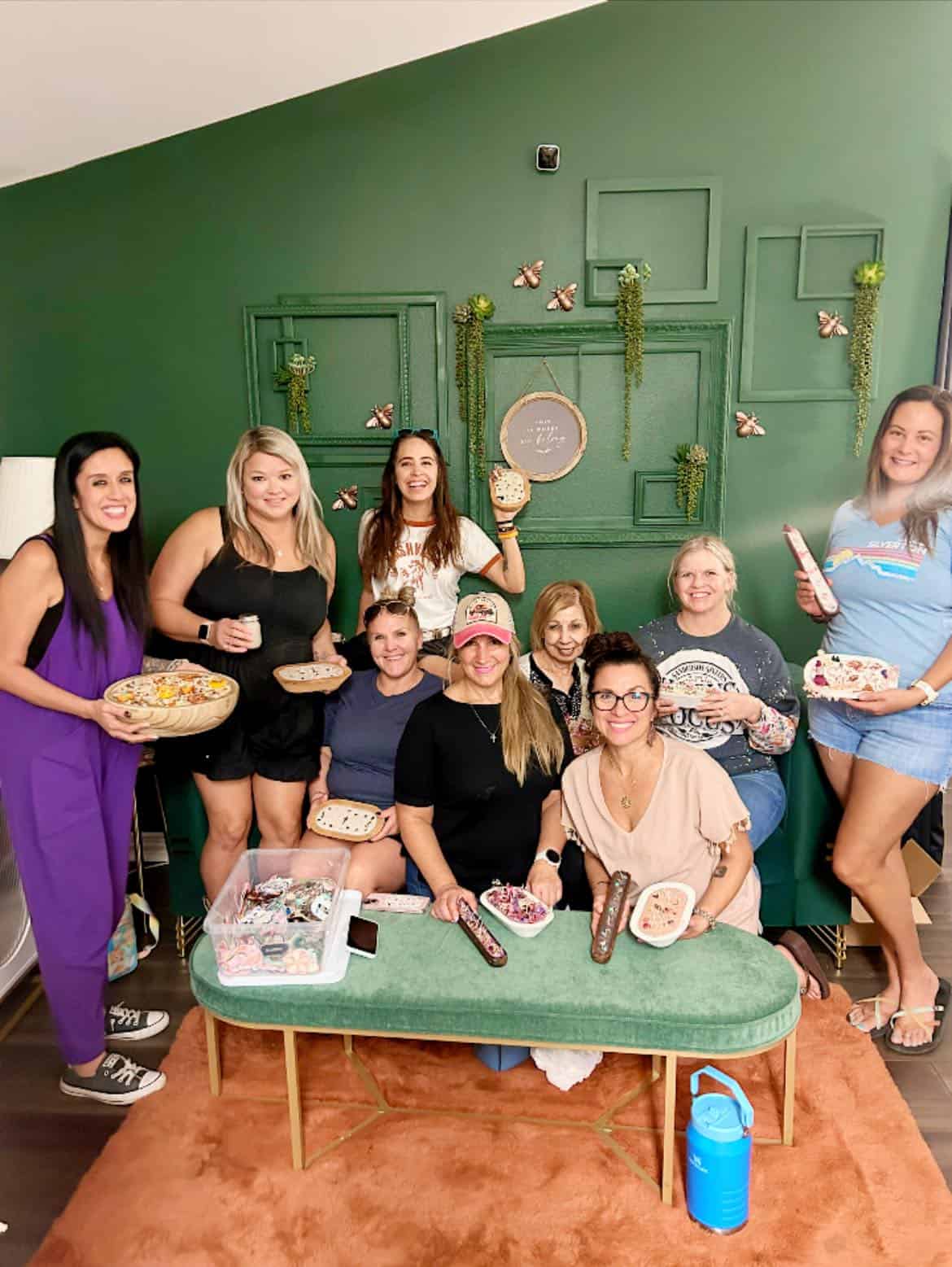 Group of women enjoying a fun, social event with food and drinks.