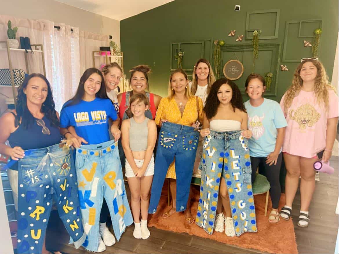Stylish women and kids showcasing personalized denim pants with unique designs.