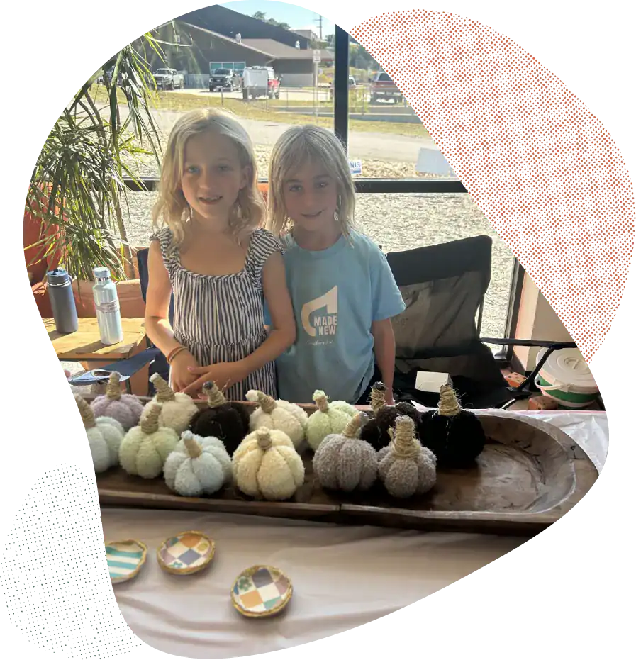 Kids' craft event with children creating handmade felted pumpkins and decorated cookies. Fun and cre.