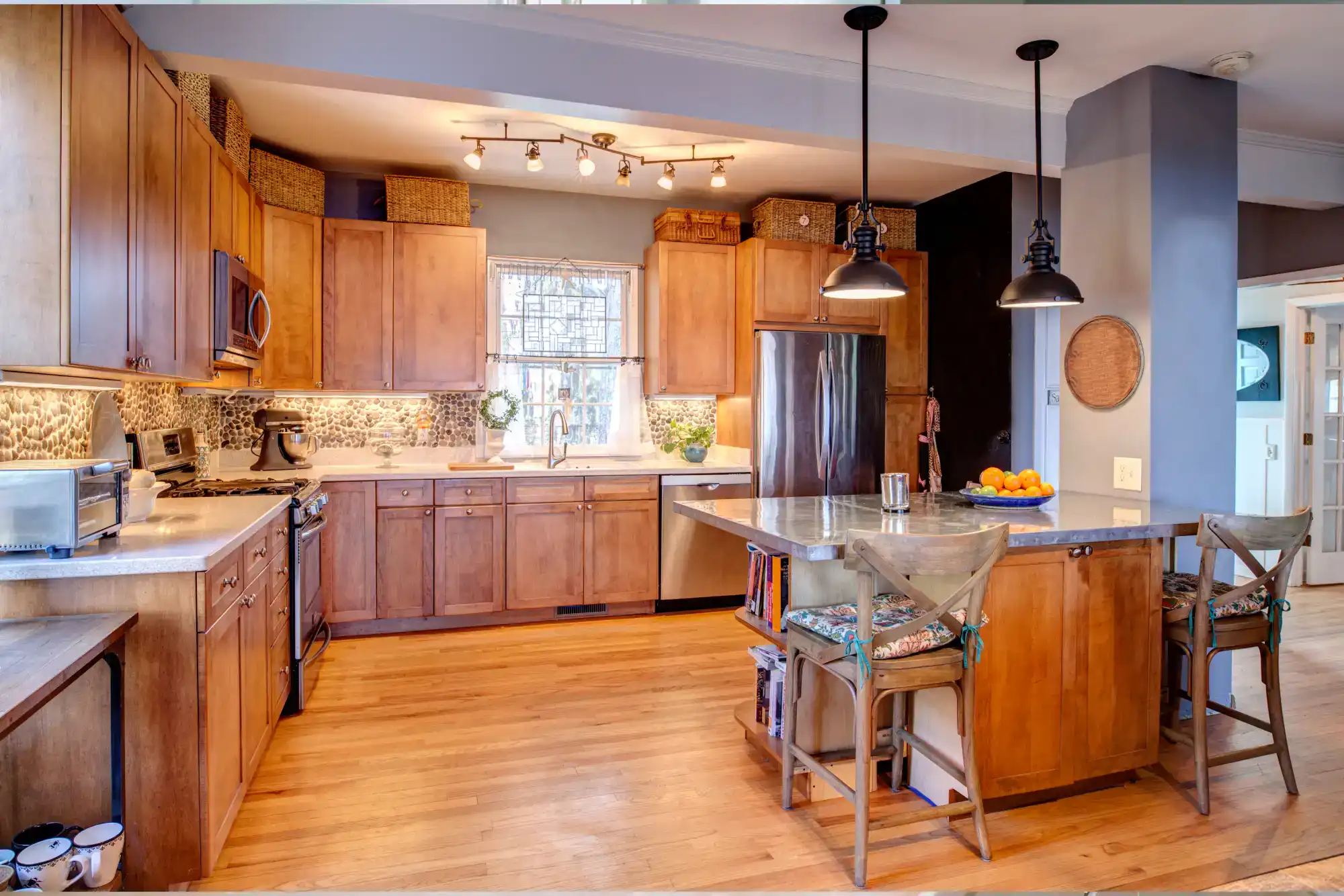 Beautifully remodeled kitchen with wooden cabinets and modern appliances in San Jose.