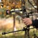Bow being aimed with attached Dead Ringer Sight and Stabilizer