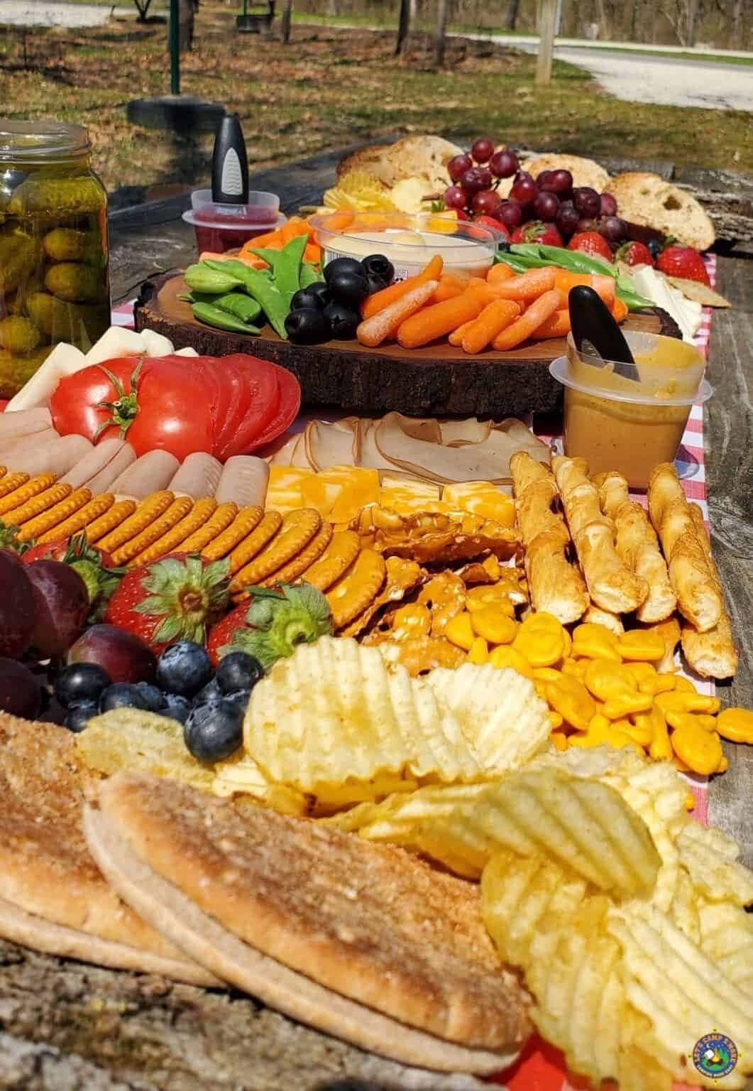 Camping charcuterie board with hardy snacks