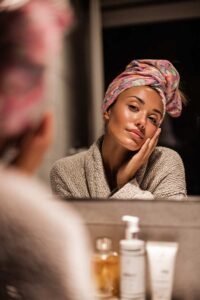 Evening skincare routine — woman applying cream, soothing self-care ritual for restful sleep