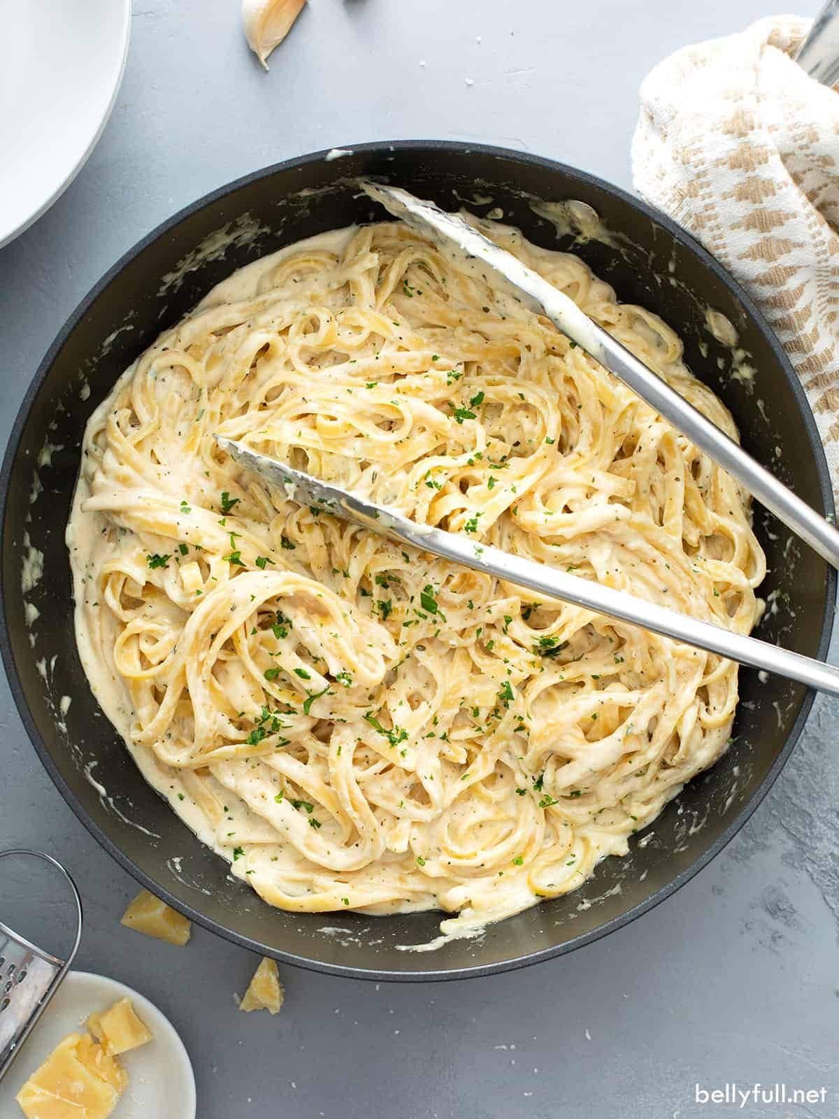 Classic homemade Alfredo sauce with butter, cream, and parmesan served over freshly cooked pasta
