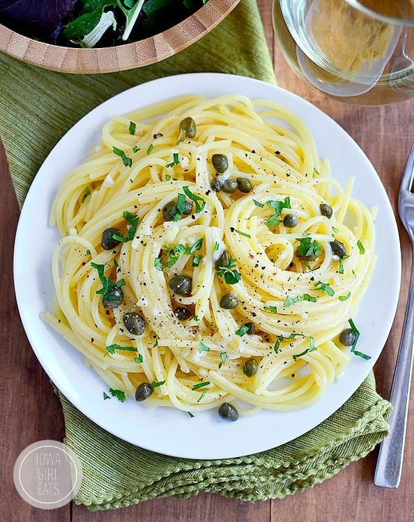Pasta tossed in garlic butter caper sauce with fresh herbs