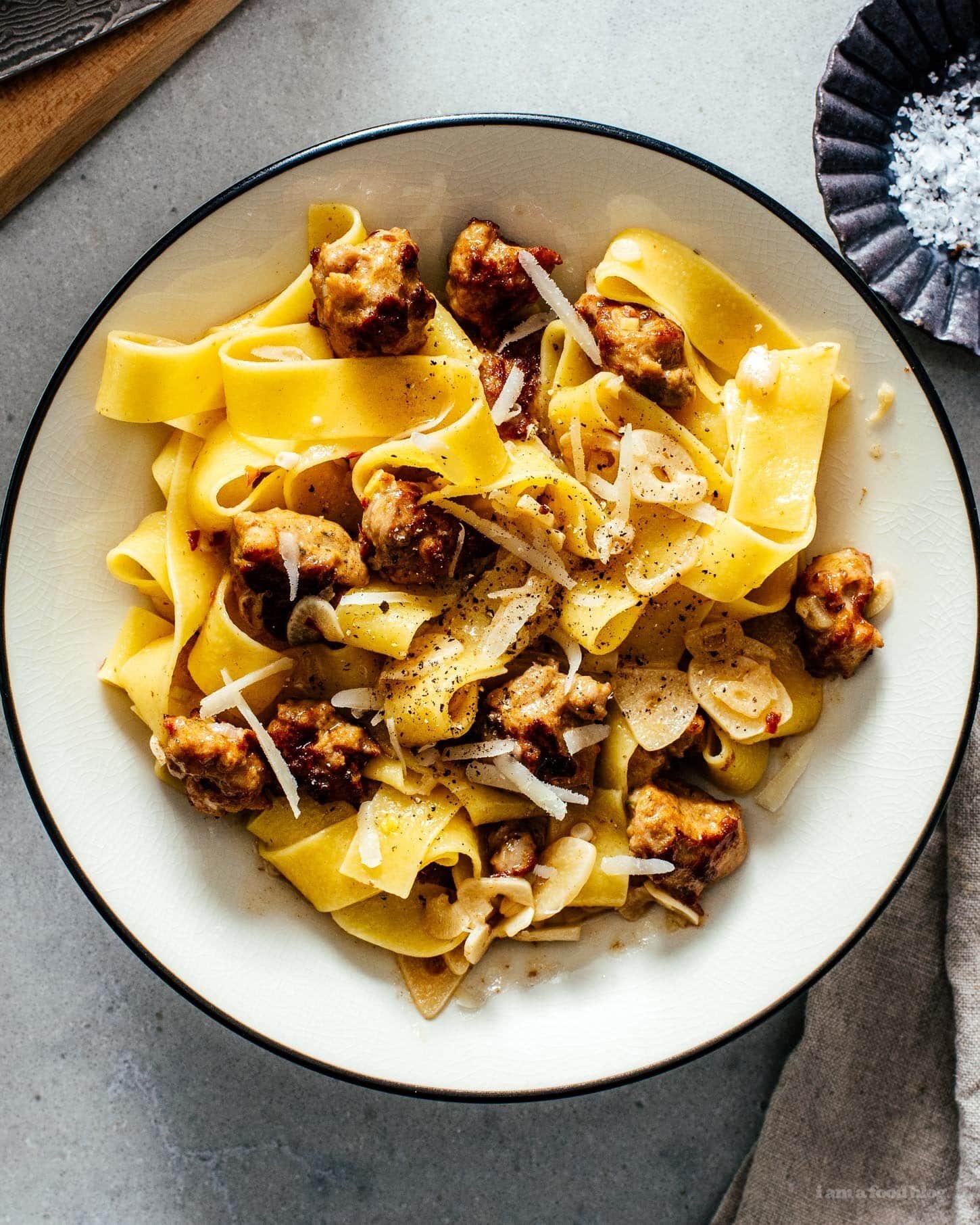 Garlic parmesan pasta with sausage in a bowl
