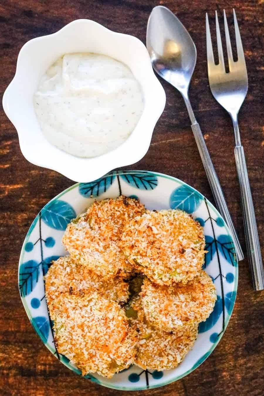Air fryer fried pickles served with dipping sauce.
