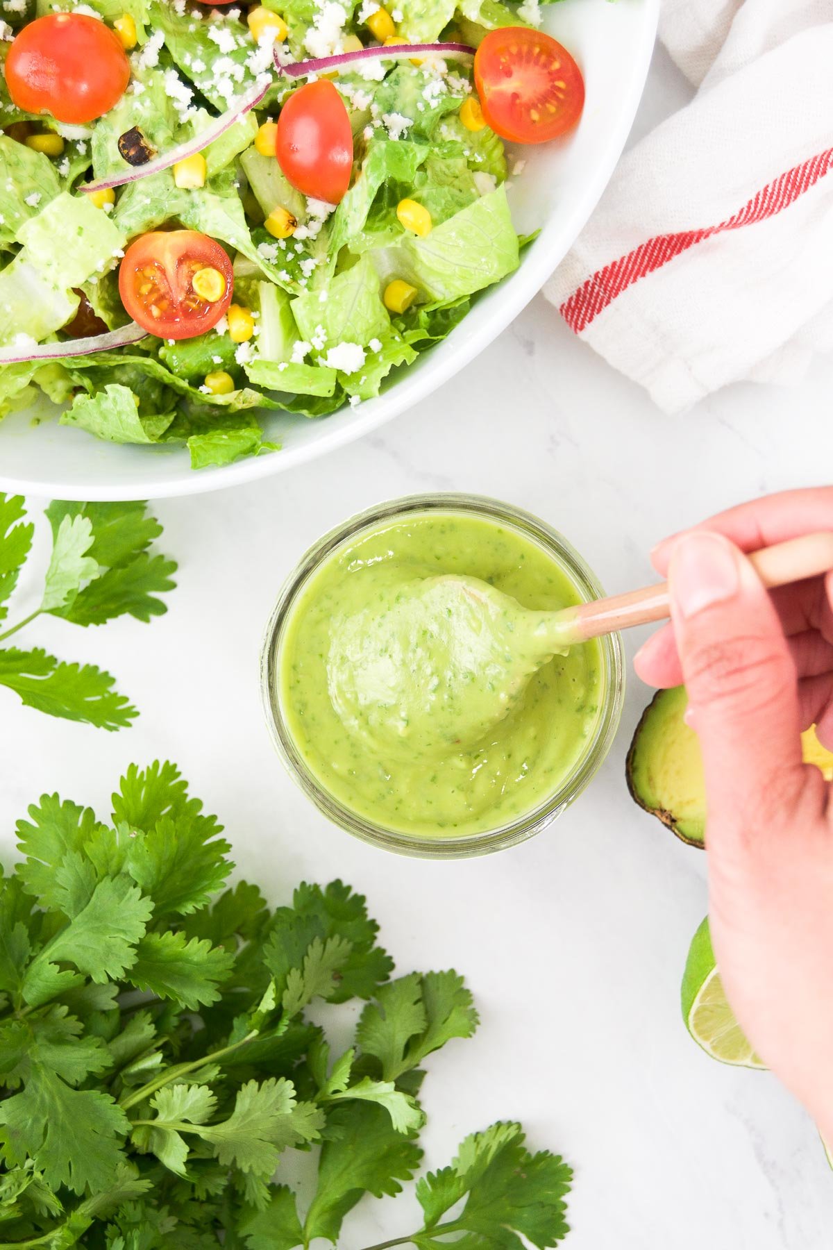 Creamy avocado lime dressing in a jar for salads