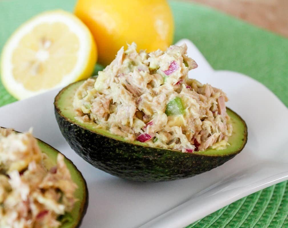 Avocado tuna salad served on toast with fresh herbs
