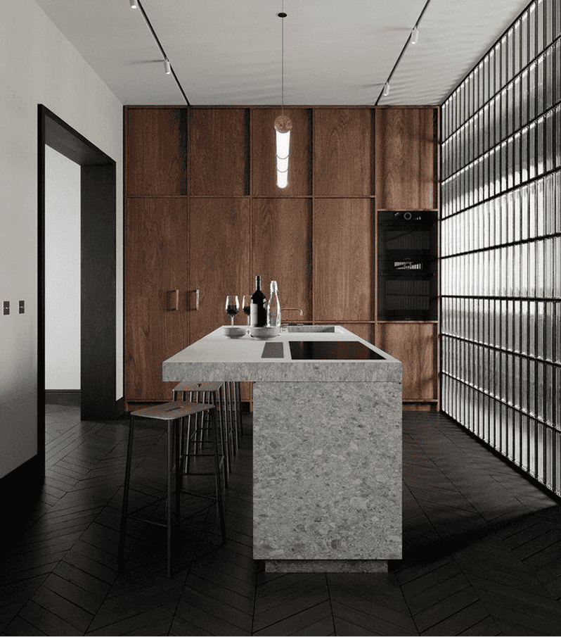 Modern kitchen with stone island and wood paneling