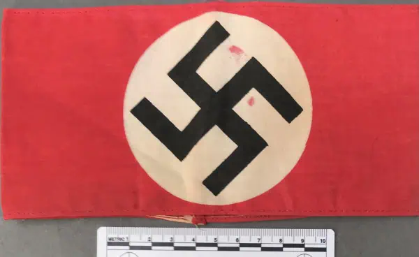 Swastika flag from World War II era with red background and white circle.