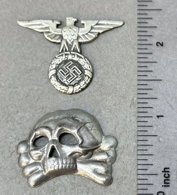 WWII German eagle badge with swastika and skull motif, metal insignia from the Gettysburg Museum of.