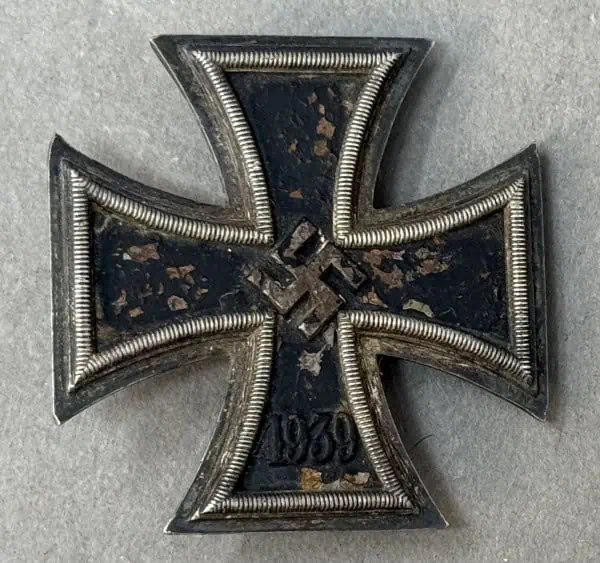 WWII Iron Cross medal with swastika and date 1939, historical military decoration from Nazi Germany.