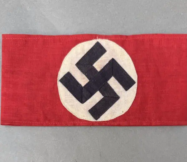 WWII Nazi swastika flag displayed on gray background.