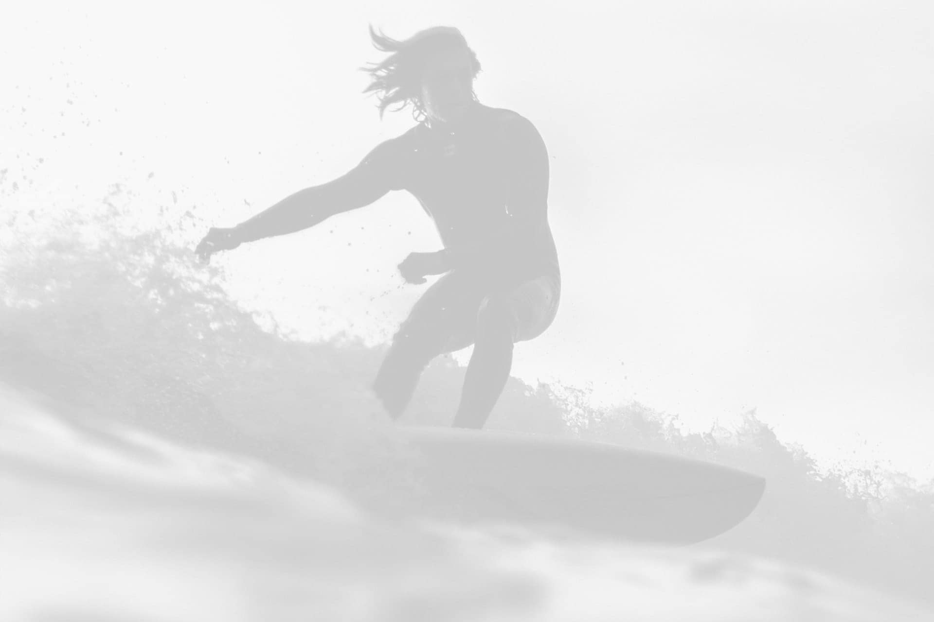 Surfer riding a wave for HGH health and fitness benefits.