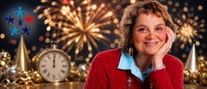 Woman smiling during New Year celebration with fireworks, clock, and festive decorations, symbolizing reflection and new beginnings for the year ahead.