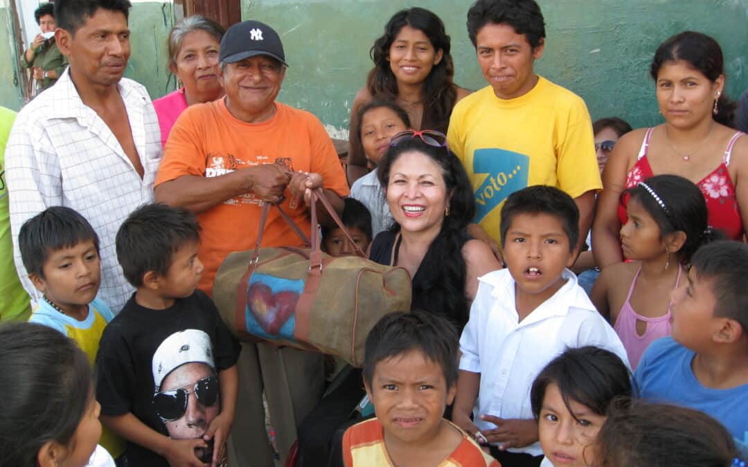 Donation donation distribution charity community kids volunteers smiling people group children helping hands Guatemala social outreach humanitarian aid Asian children charity event with diverse individuals in outdoor setting.