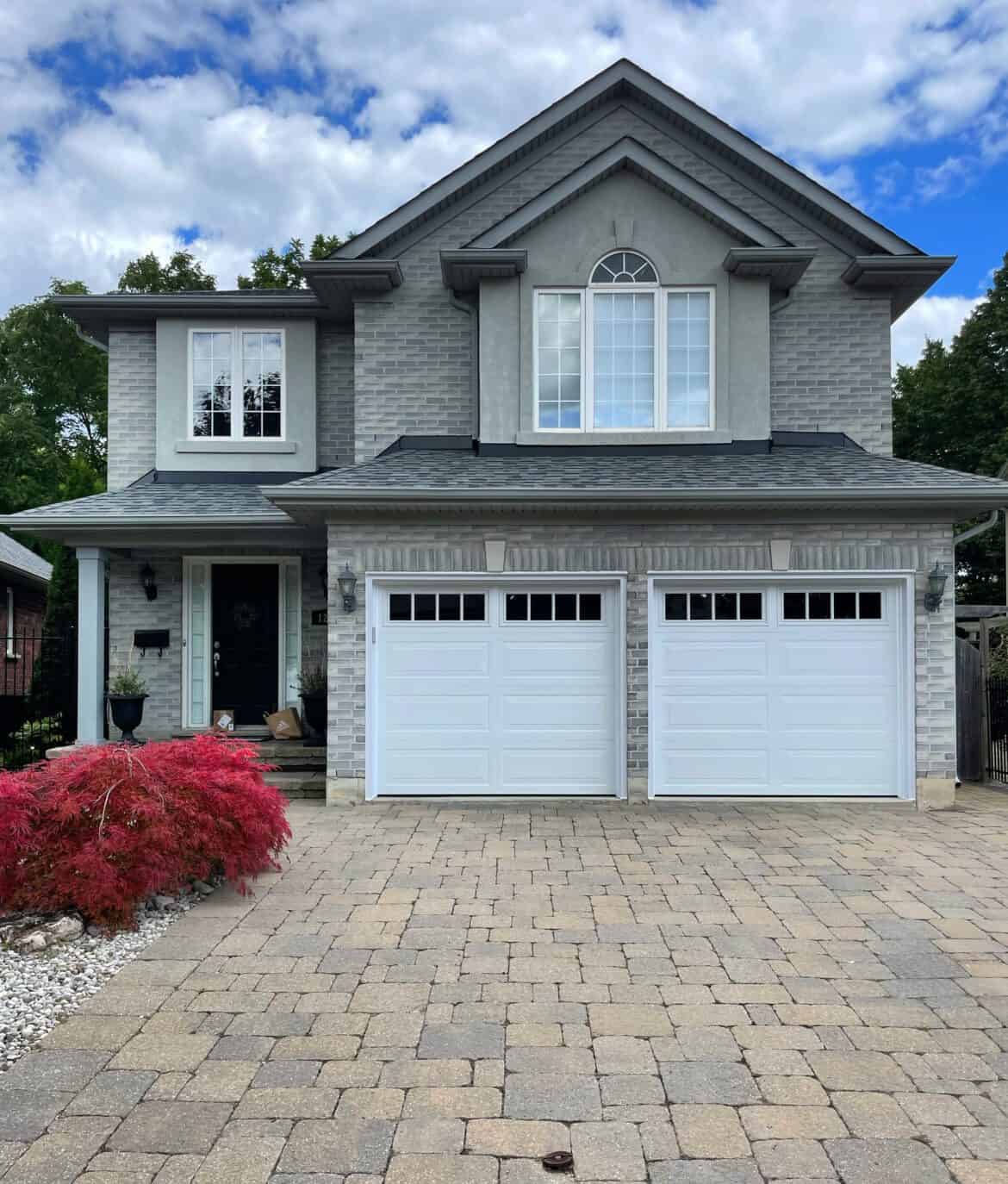 White raised panel doors 8x7 on grey house