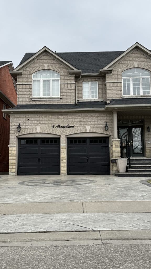 New black carriage-style steel garage door installed in Brampton